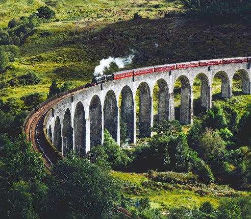 A Jacobite steam train crossing the famous Glenfinnan Viaduct
